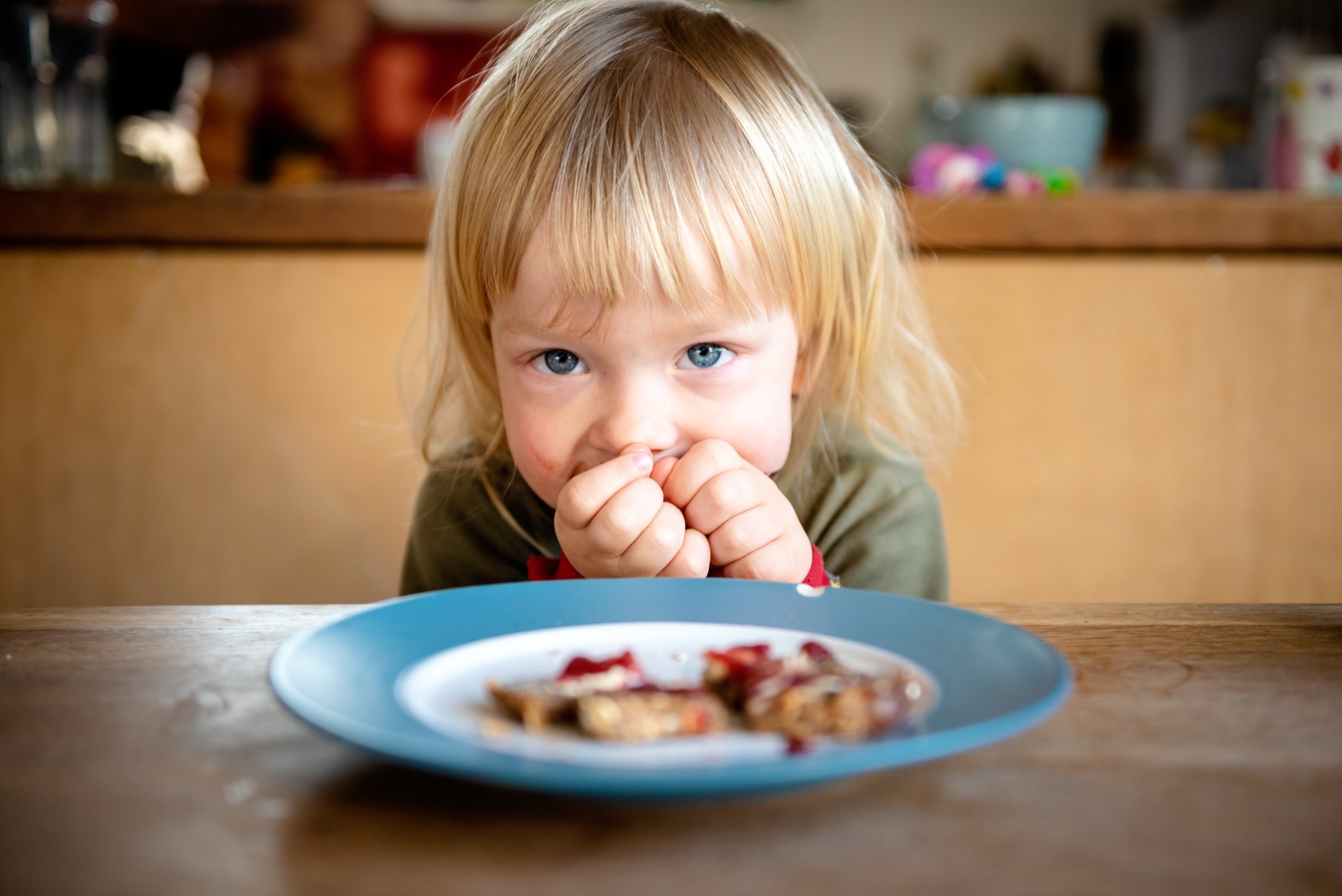 A young child at the kitchen table