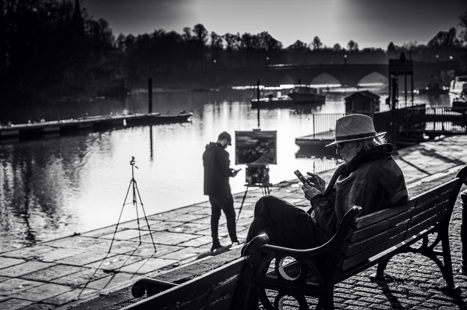 A photographer at work by a lake